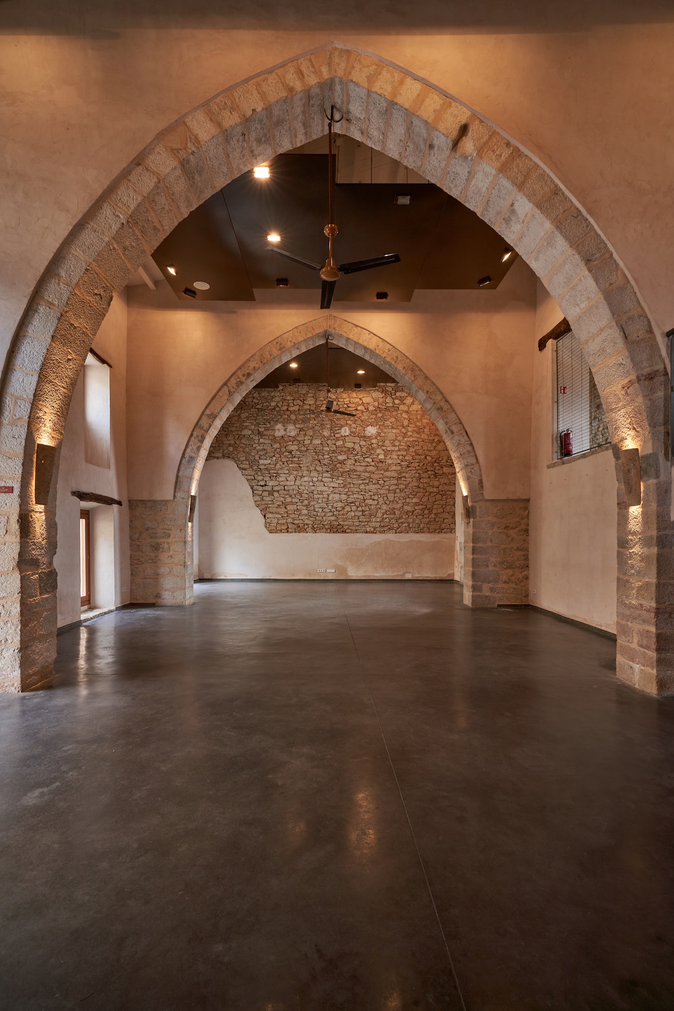 Hallway with arched passages in old building